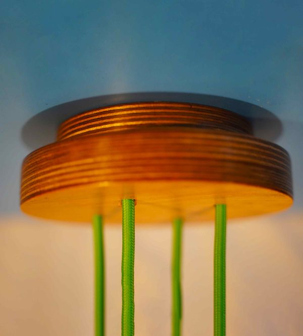 Contemporary Quad Cable Ceiling Rose with exposed plywood edge & hanging from a yellow fabric cable