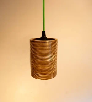 Single Bulb Round Pendant Light made of layered birch plywood with a smooth finish, suspended by a yellow fabric cable.