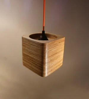 Single Bulb Square Pendant Light made of layered birch plywood with a smooth finish, suspended by an orange fabric cable